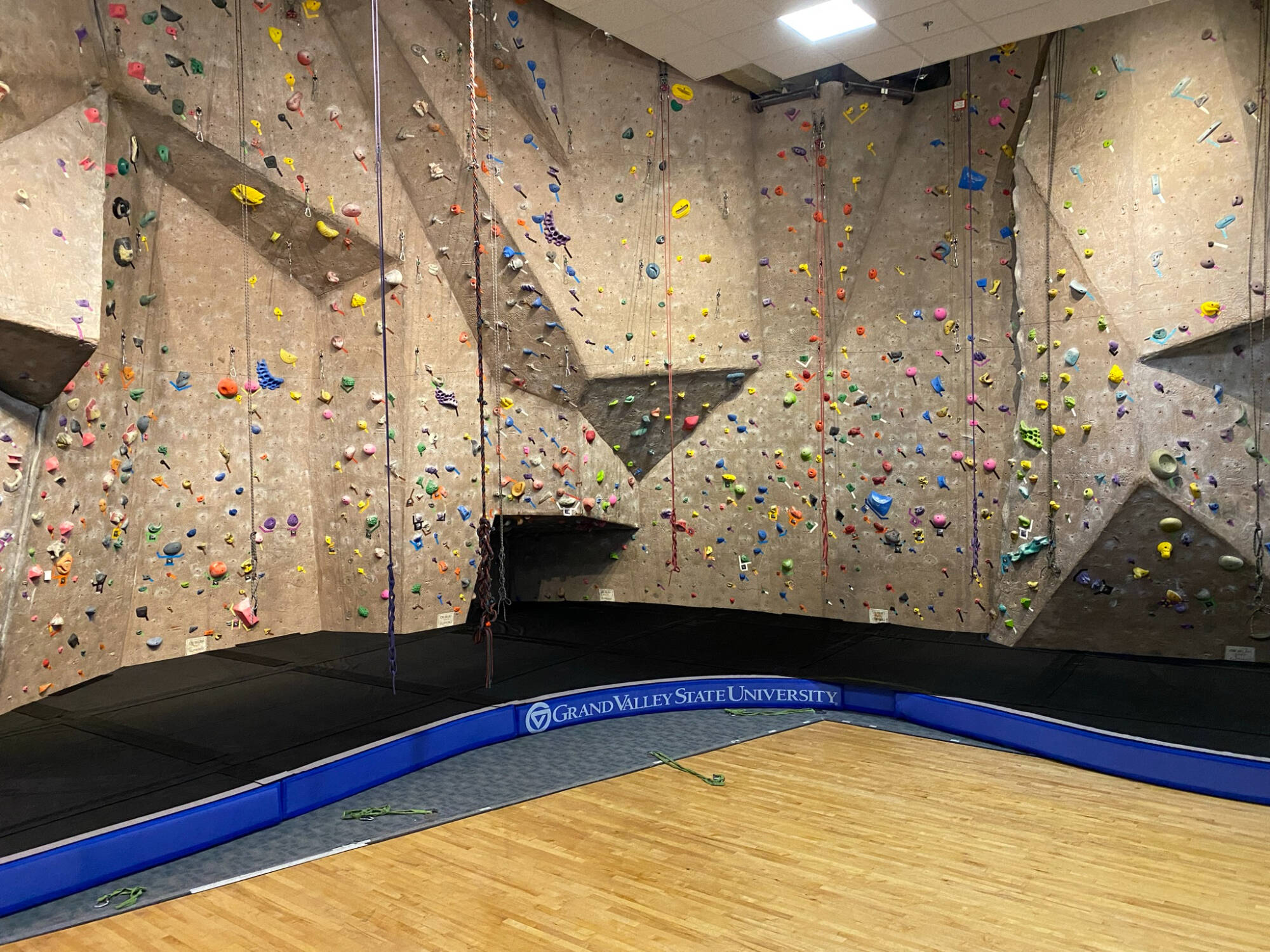 empty climbing wall with new custom fit GVSU branded flooring